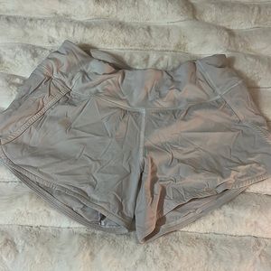 White Lululemon running shorts with back zip pocket